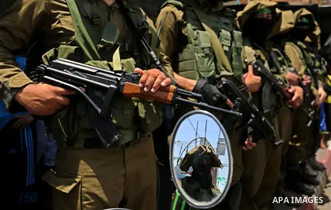 Members of the Ezzedine al-Qassam Brigades, the military wing of the Palestinian Islamist movement Hamas, attend the funeral of their comrade Ibrahim Abu Al-Naja in Rafah, southern Gaza Strip June 8, 2017. Photo by Ashra...