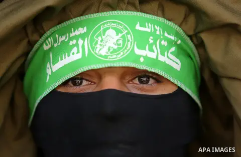 A Member of the Ezzedine al-Qassam Brigades, the military wing of the Palestinian Islamist movement Hamas, attends the funeral of his comrade Ibrahim Abu Al-Naja in Rafah, southern Gaza Strip June 8, 2017. Photo by Ashra...