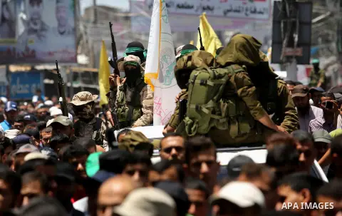 Palestinians attend the funeral of a member the Ezzedine al-Qassam Brigades, the military wing of the Palestinian Islamist movement Hamas of Ibrahim Abu Al-Naja, in Rafah, southern Gaza Strip June 8, 2017. Photo by Ashra...