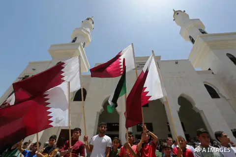 Palestinians take part in a rally in support of Qatar, inside Qatari-funded construction project 'Hamad City', in Khan Younis in the southern Gaza Strip, June 9, 2017. Photo by Ashraf Amra
