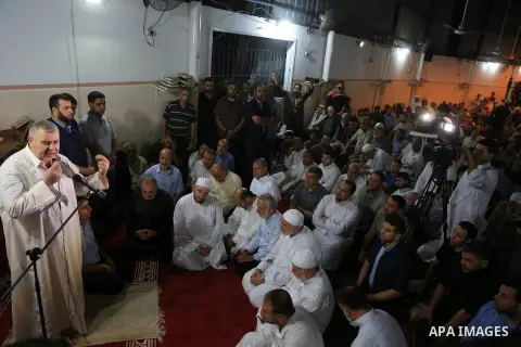 Palestinian mourners pray over the body of Aaed Goma, 35, who was killed by Israeli gunfire during clashes, in Jabalia refugee camp in the northern Gaza strip on June 09, 2017. Photo by Dawod Abo Elkass