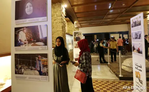 Palestinians participate in a photo gallery organized by Red cross (ICRC) on the occasion of over 50 years of its presence in the occupied Palestinian territories, in Gaza city on June 13, 2017. Photo by Ashraf Amra