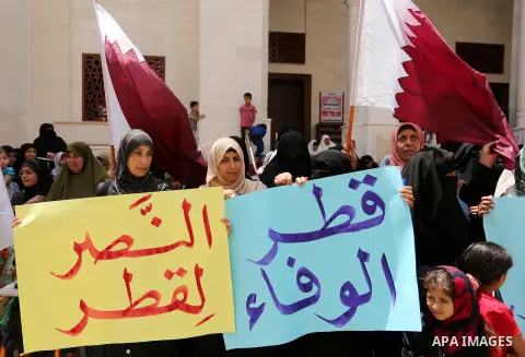 Palestinian women take part in a rally in support of Qatar, inside Qatari-funded construction project 'Hamad City', in Khan Younis in the southern Gaza Strip, June 14, 2017. Photo by Ashraf Amra