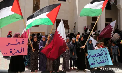 Palestinian women take part in a rally in support of Qatar, inside Qatari-funded construction project 'Hamad City', in Khan Younis in the southern Gaza Strip, June 14, 2017. Photo by Ashraf Amra