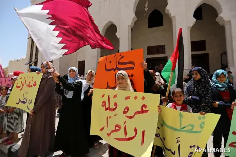 Palestinian women take part in a rally in support of Qatar, inside Qatari-funded construction project 'Hamad City', in Khan Younis in the southern Gaza Strip, June 14, 2017. Photo by Ashraf Amra