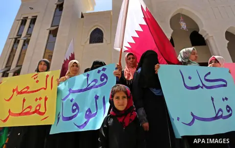 Palestinian women take part in a rally in support of Qatar, inside Qatari-funded construction project 'Hamad City', in Khan Younis in the southern Gaza Strip, June 14, 2017. Photo by Ashraf Amra