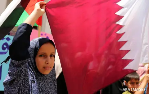 Palestinian women take part in a rally in support of Qatar, inside Qatari-funded construction project 'Hamad City', in Khan Younis in the southern Gaza Strip, June 14, 2017. Photo by Ashraf Amra