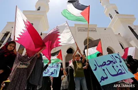 Palestinian women take part in a rally in support of Qatar, inside Qatari-funded construction project 'Hamad City', in Khan Younis in the southern Gaza Strip, June 14, 2017. Photo by Ashraf Amra