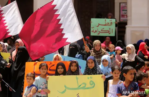 Palestinian women take part in a rally in support of Qatar, inside Qatari-funded construction project 'Hamad City', in Khan Younis in the southern Gaza Strip, June 14, 2017. Photo by Ashraf Amra