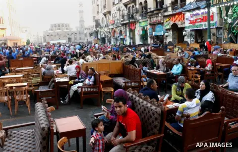 Egyptian muslims take their breakfast during the holy fasting month of Ramadan in front of al-Hussein mosque at Al-Azhar district in old Islamic Cairo, Egypt, on June 17, 2017. Ramadan is sacred to Muslims because it is...