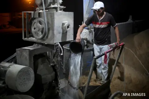 A Palestinian labourer works at a cement factory at night, to avoid the day time heat, on the Muslim holy fasting month of Ramadan in Gaza city on June 17, 2017. Ramadan is sacred to Muslims because it is during that mon...