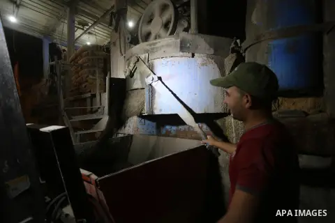 A Palestinian labourer works at a cement factory at night, to avoid the day time heat, on the Muslim holy fasting month of Ramadan in Gaza city on June 17, 2017. Ramadan is sacred to Muslims because it is during that mon...