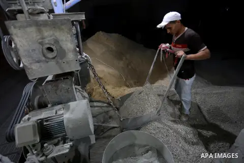 A Palestinian labourer works at a cement factory at night, to avoid the day time heat, on the Muslim holy fasting month of Ramadan in Gaza city on June 17, 2017. Ramadan is sacred to Muslims because it is during that mon...