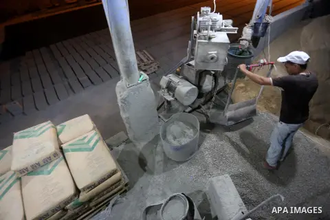A Palestinian labourer works at a cement factory at night, to avoid the day time heat, on the Muslim holy fasting month of Ramadan in Gaza city on June 17, 2017. Ramadan is sacred to Muslims because it is during that mon...