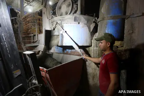 A Palestinian labourer works at a cement factory at night, to avoid the day time heat, on the Muslim holy fasting month of Ramadan in Gaza city on June 17, 2017. Ramadan is sacred to Muslims because it is during that mon...