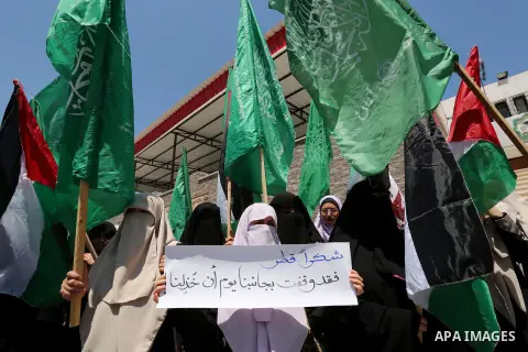 Palestinian women take part in a rally in support of Qatar and against the blockade on the Gaza Strip, in front of the Legislative Council in Gaza city on June 18, 2017. Photo by Ashraf Amra