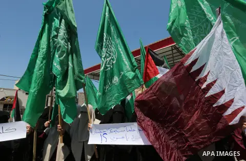 Palestinian women take part in a rally in support of Qatar and against the blockade on the Gaza Strip, in front of the Legislative Council in Gaza city on June 18, 2017. Photo by Ashraf Amra