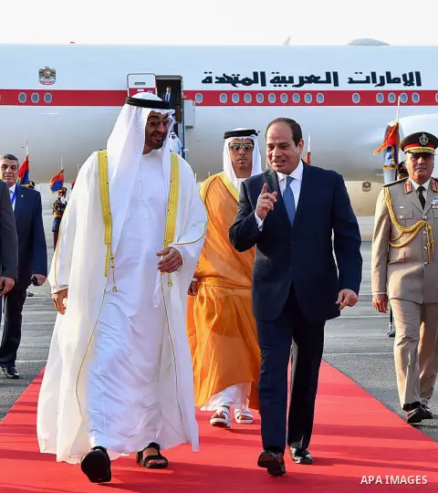 Egyptian President Abdel Fattah al-Sis walks with Abu Dhabi Crown Prince Sheikh Mohammed bin Zayed al-Nahyan after he arrives in Cairo International Airport on June 19, 2017. Photo by Egyptian President Office