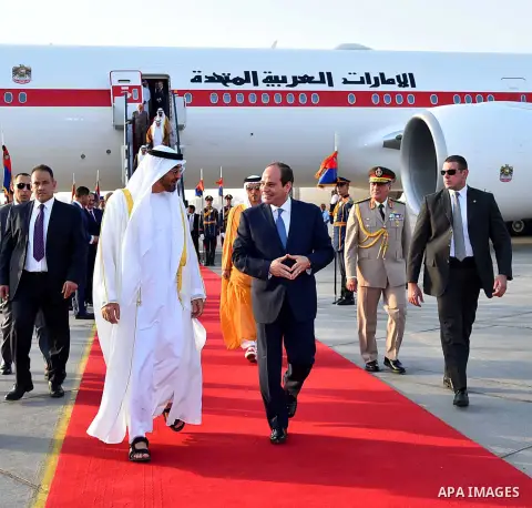 Egyptian President Abdel Fattah al-Sis walks with Abu Dhabi Crown Prince Sheikh Mohammed bin Zayed al-Nahyan after he arrives in Cairo International Airport on June 19, 2017. Photo by Egyptian President Office