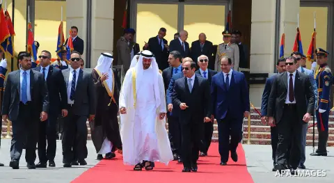 Egyptian President Abdel Fattah Sisi bids farewell to bu Dhabi Crown Prince Sheikh Mohammed bin Zayed al-Nahyan at Cairo International Airport in Cairo on June 20, 2017. Photo by Egyptian President Office