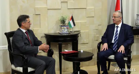 Palestinian Prime Minister Rami Hamdallah meets with Swiss representative to Palestine Paul Garnier, at his office in the West Bank city of Ramallah on June 21, 2017. Photo by Prime Minister Office
