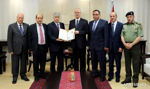 Palestinian Prime Minister Rami Hamdallah receives report of the Palestinian retirement Authority for 2016, at his office in the West Bank city of Ramallah on June 22, 2017. Photo by Prime Minister Office