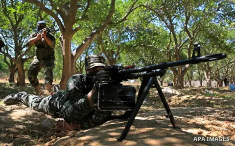 Palestinian militants from the Al-Quds Brigades, the armed wing of the Islamic Jihad movement guard the border in the east of Gaza city on the Muslim holy fasting month of Ramadan on June 22, 2017. Ramadan is sacred to M...