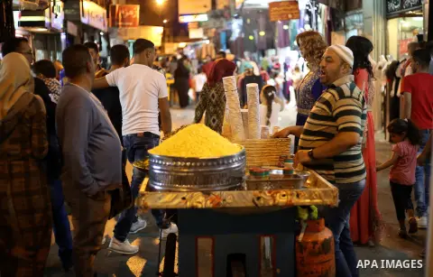 Palestinians shop at a market a few days ahead of Eid al-Fitr holiday, in the West Bank city of Nablus on June 23, 2017. Eid al-Fitr marks the end of Muslim's holy fasting month of Ramadan when faithfuls abstain from eat...