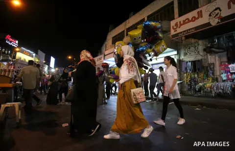 Palestinians shop at a market a few days ahead of Eid al-Fitr holiday, in the West Bank city of Nablus on June 23, 2017. Eid al-Fitr marks the end of Muslim's holy fasting month of Ramadan when faithfuls abstain from eat...