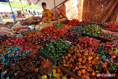 A Palestinian vendor sells chocolate at a market ahead of Eid al-Fitr holiday, in Gaza city on June 24, 2017. Eid al-Fitr marks the end of Muslim's holy fasting month of Ramadan when faithfuls abstain from eating, drinki...