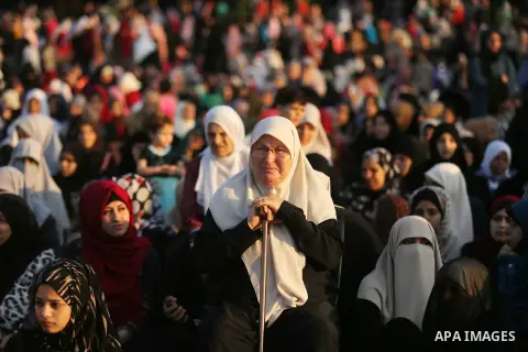 Palestinian Muslim women perform Eid al-Fitr prayers in Gaza City June 25, 2017. Eid al-Fitr marks the end of Muslim's holy fasting month of Ramadan when faithfuls abstain from eating, drinking, smoking and sexual activi...