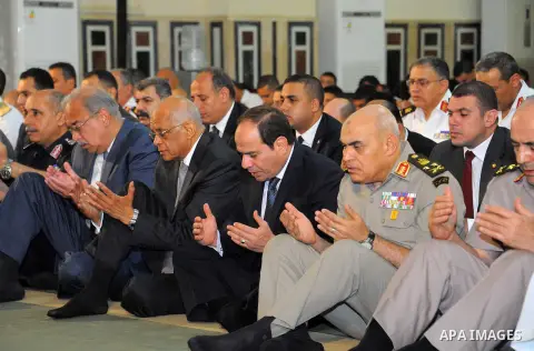 Egyptian President Abdel Fattah al-Sisi performs the morning prayer of Eid al-Fitr holiday which marks the end of the Muslim holy month of Ramadan, in Cairo, Egypt, on June 25, 2017. Photo by Egyptian President Office