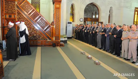 Egyptian President Abdel Fattah al-Sisi performs the morning prayer of Eid al-Fitr holiday which marks the end of the Muslim holy month of Ramadan, in Cairo, Egypt, on June 25, 2017. Photo by Egyptian President Office