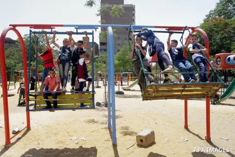 Egyptians celebrate at a park, in Cairo June 26, 2017, on the second day of Eid al-Fitr holiday which marks the end of the Muslim holy month of Ramadan. Photo by Amr Sayed