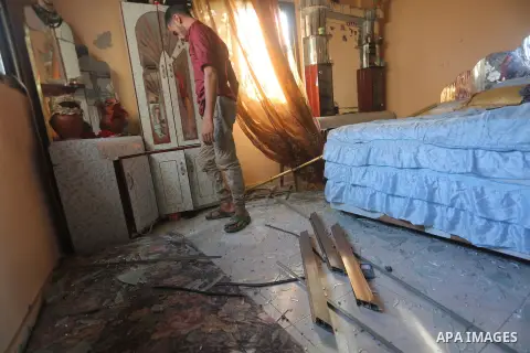 A Palestinian man inspects his home following an Israeli air strike in Gaza City on June 27, 2017. Israeli airstrikes hit a series of targets in the Hamas-run Gaza Strip overnight June 26, officials said, hours after a r...