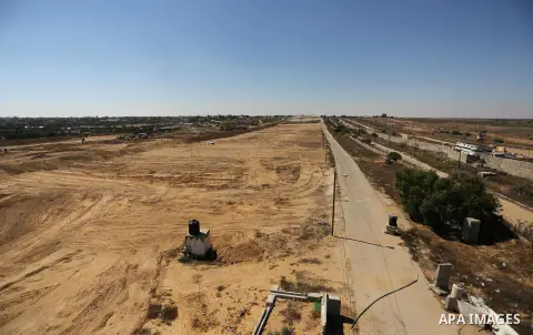 Parliment Palestinian bulldozers clear an area as Hamas begins creating a large buffer zone on the border with Egypt in the southern Gaza strip town of Rafah, on June 29, 2017. The buffer zone is expected to extend for a...