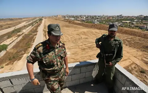 Members of Palestinian security forces patrol a section of the border with Egypt, in the southern Gaza strip town of Rafah, on June 29, 2017. The buffer zone is expected to extend for a length of 12 kilometres and at a w...