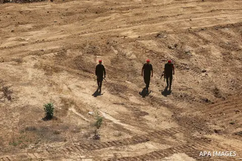 Members of Palestinian security forces patrol a section of the border with Egypt, in the southern Gaza strip town of Rafah, on June 29, 2017. The buffer zone is expected to extend for a length of 12 kilometres and at a w...