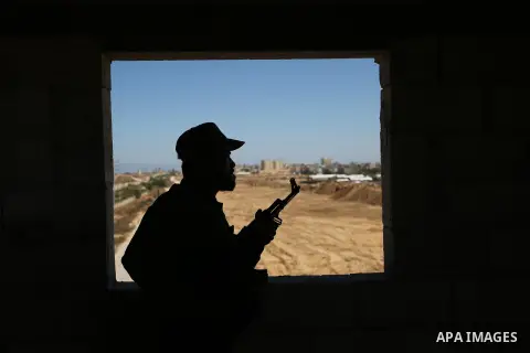 A member of Palestinian security forces stands guard during patrol a section of the border with Egypt, in the southern Gaza strip town of Rafah, on June 29, 2017. The buffer zone is expected to extend for a length of 12...