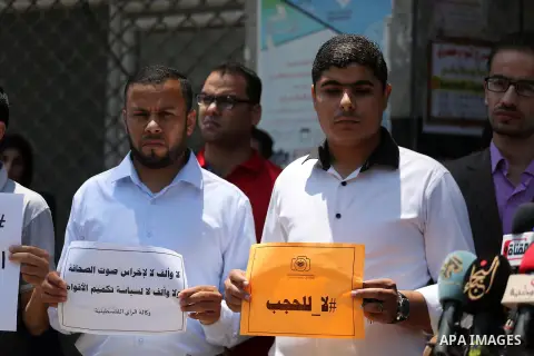 Palestinian journalists take part in a protest against the decision of Palestinian Authority's public prosecutor to block 11 Palestinian news websites in the Israeli-occupied West Bank, in Gaza city on July 01, 2017. Pho...