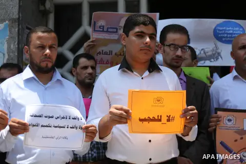 Palestinian journalists take part in a protest against the decision of Palestinian Authority's public prosecutor to block 11 Palestinian news websites in the Israeli-occupied West Bank, in Gaza city on July 01, 2017. Pho...