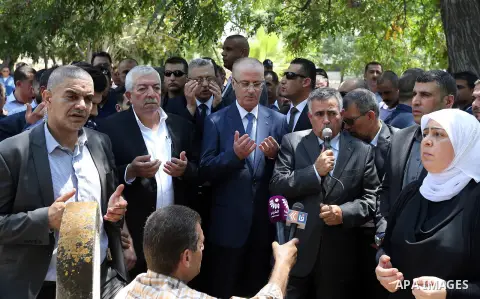 Palestinian Prime Minister Rami Hamdallah attends the funeral of Governor of Tubas Governorate, Rabhi al-Khandakji in the West Bank city of Tulkarem, on July 8, 2017. Photo by Prime Minister Office