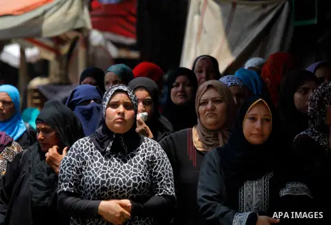 Egyptian relatives react during the funeral of officer Khaled al-Maghrabi, who was killed during a suicide bomb attack on an army checkpoint in Sinai, in his hometown Toukh, Al Qalyubia Governorate, north of Cairo, Egypt...