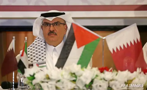 Qatar's Ambassador to the Palestinian Authority, Mohammed Al Emadi, delivers financial payments to the project to repair the homes of poor families, in Gaza city on July 10, 2017. Photo by Ashraf Amra