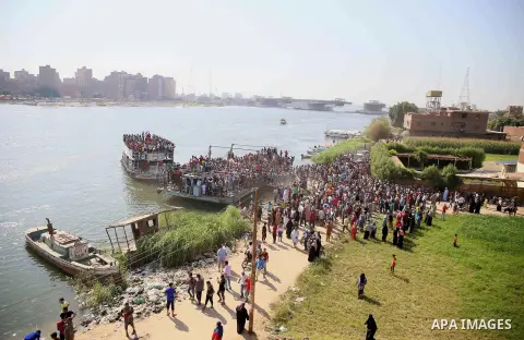 Egyptians gather during the operations of removal of illegal buildings which built on the state lands in the Warraq district of Giza, southwest of Cairo, Egypt, on July 16, 2017. Photo by Amr Sayed