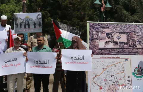 Palestinians take part in a protest against the recent closure of the Al-Aqsa Mosque compound by Israel, in Gaza City on July 17, 2017. Photo by Mohammed Asad