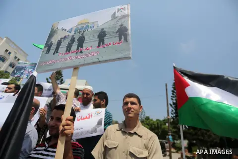 Palestinians take part in a protest against the recent closure of the Al-Aqsa Mosque compound by Israel, in Gaza City on July 17, 2017. Photo by Mohammed Asad