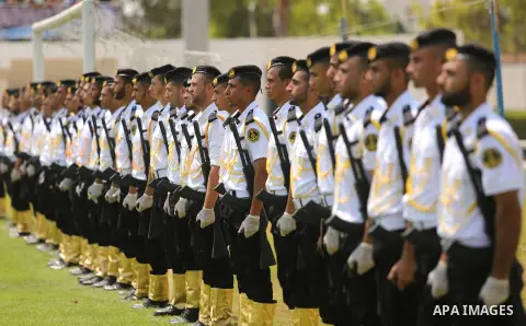 Palestinian policemen take part in a graduation ceremony, in Gaza City on July 17, 2017. Photo by Ashraf Amra