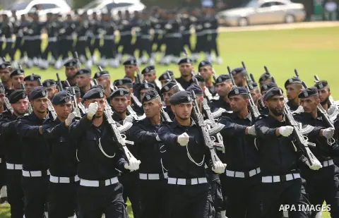 Palestinian policemen take part in a graduation ceremony, in Gaza City on July 17, 2017. Photo by Ashraf Amra