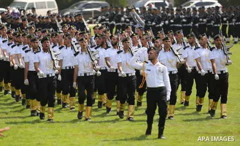 Palestinian policemen take part in a graduation ceremony, in Gaza City on July 17, 2017. Photo by Ashraf Amra